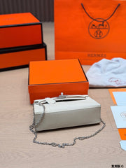 Classic Kelly clutch with silver buckle, upgraded with Swift leather.