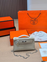 Classic Kelly clutch with silver buckle, upgraded with Swift leather.