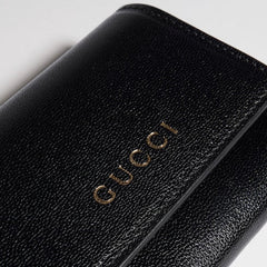 Bi-fold card case with Gucci lettering - black leather