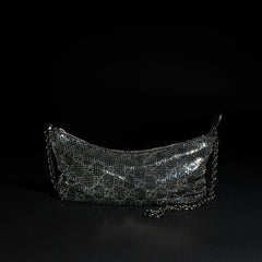 Metallic evening bag with charm
